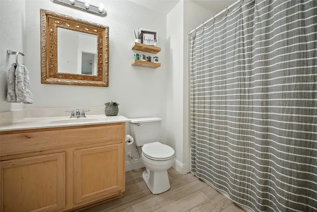 a bed sitting in a room next to a window