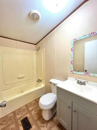 a bathroom with a sink a toilet and a bathtub