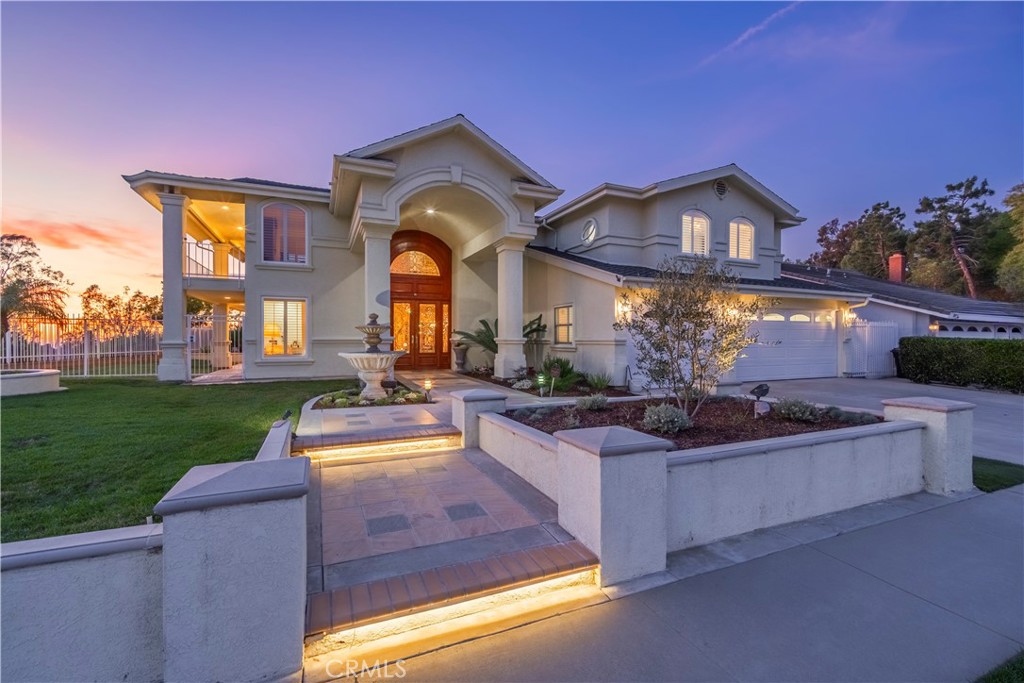8213 Seranata Drive Whittier, CA 90603 - Photo 1 of 64 a front view of a house with swimming pool yard and outdoor seating