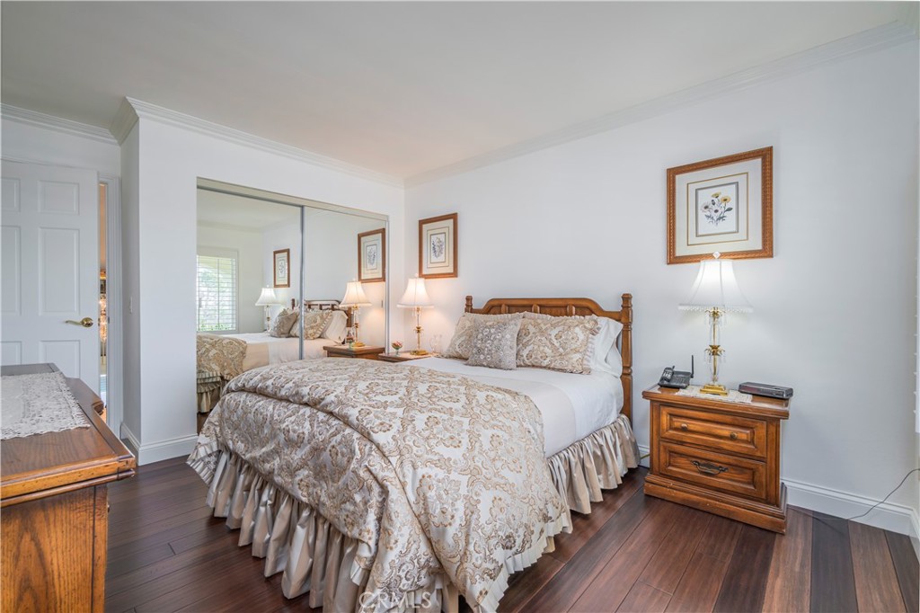 8213 Seranata Drive Whittier, CA 90603 - Photo 25 of 64 a bedroom with bed and wooden floor