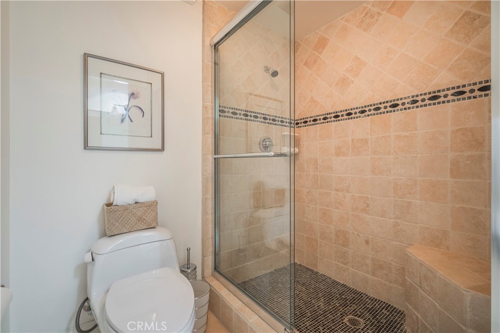 8213 Seranata Drive Whittier, CA 90603 - Photo 28 of 64 a bathroom with a shower and a toilet