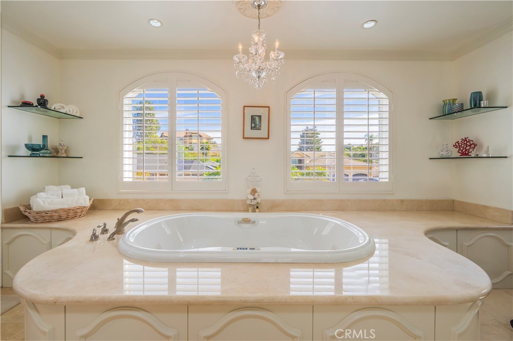 8213 Seranata Drive Whittier, CA 90603 - Photo 32 of 64 a bathroom with a tub sink and mirror