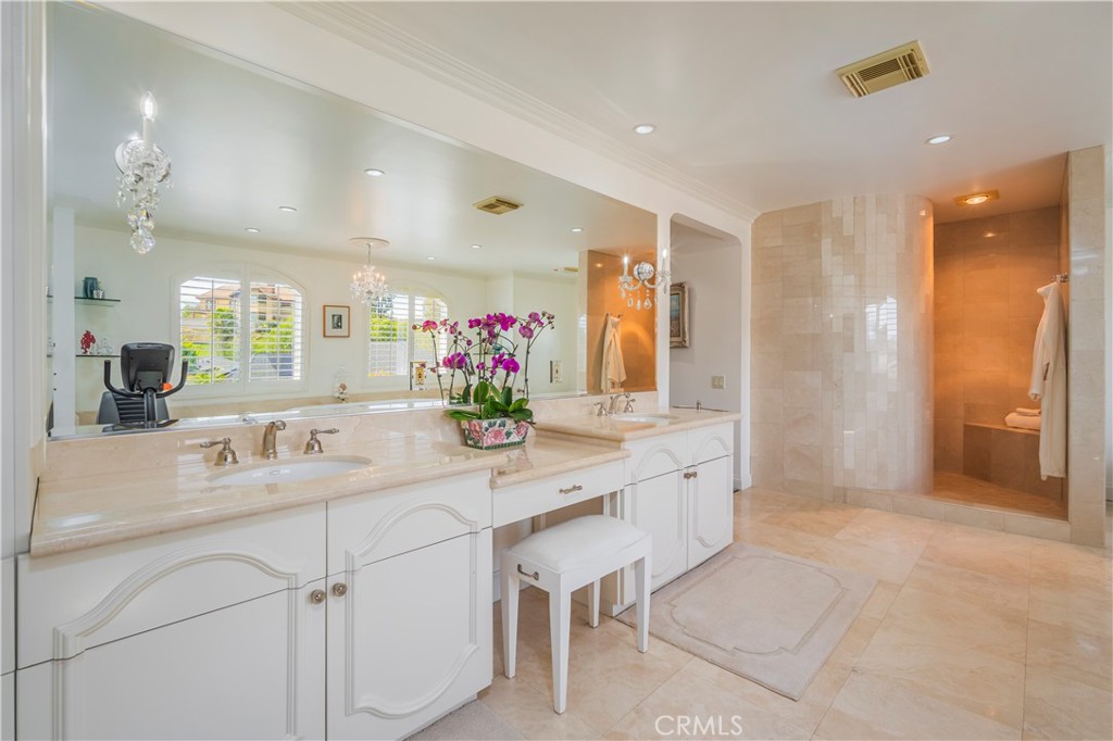 8213 Seranata Drive Whittier, CA 90603 - Photo 33 of 64 a bathroom with a sink double vanity and a mirror