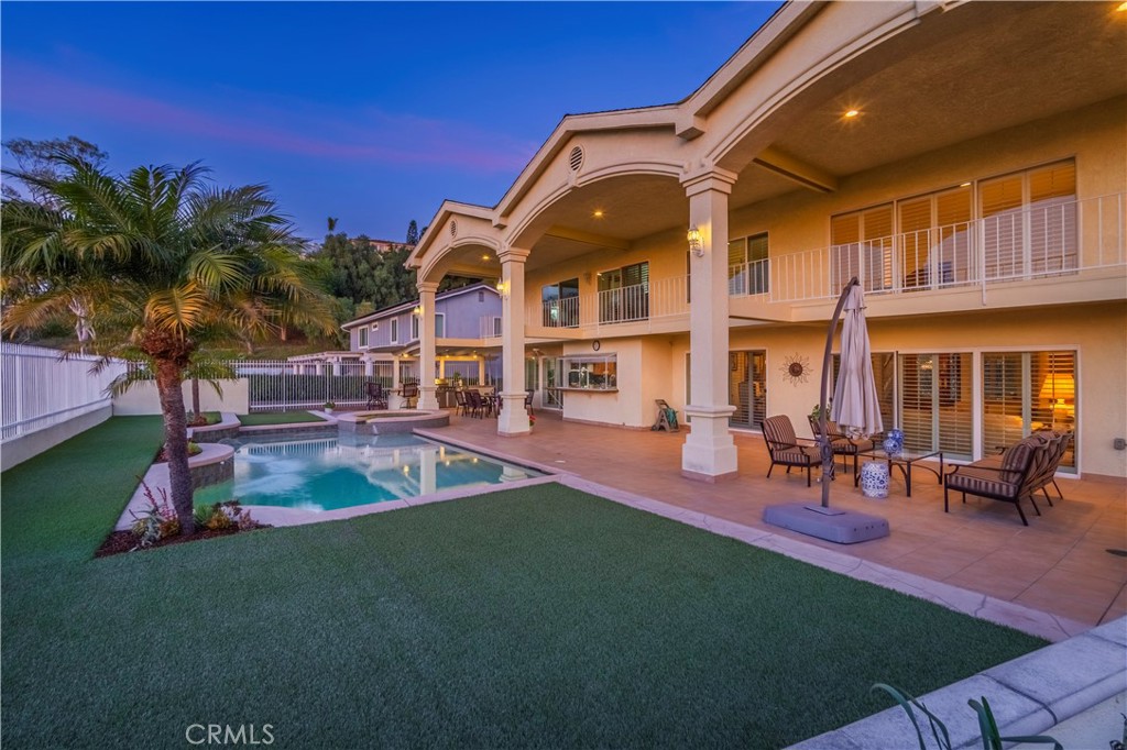 8213 Seranata Drive Whittier, CA 90603 - Photo 35 of 64 a view of a house with a swimming pool and sitting area