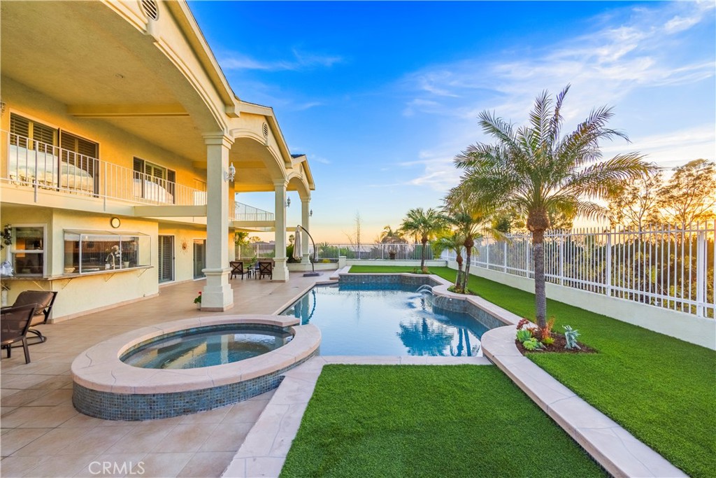8213 Seranata Drive Whittier, CA 90603 - Photo 42 of 64 a swimming pool with outdoor seating and yard
