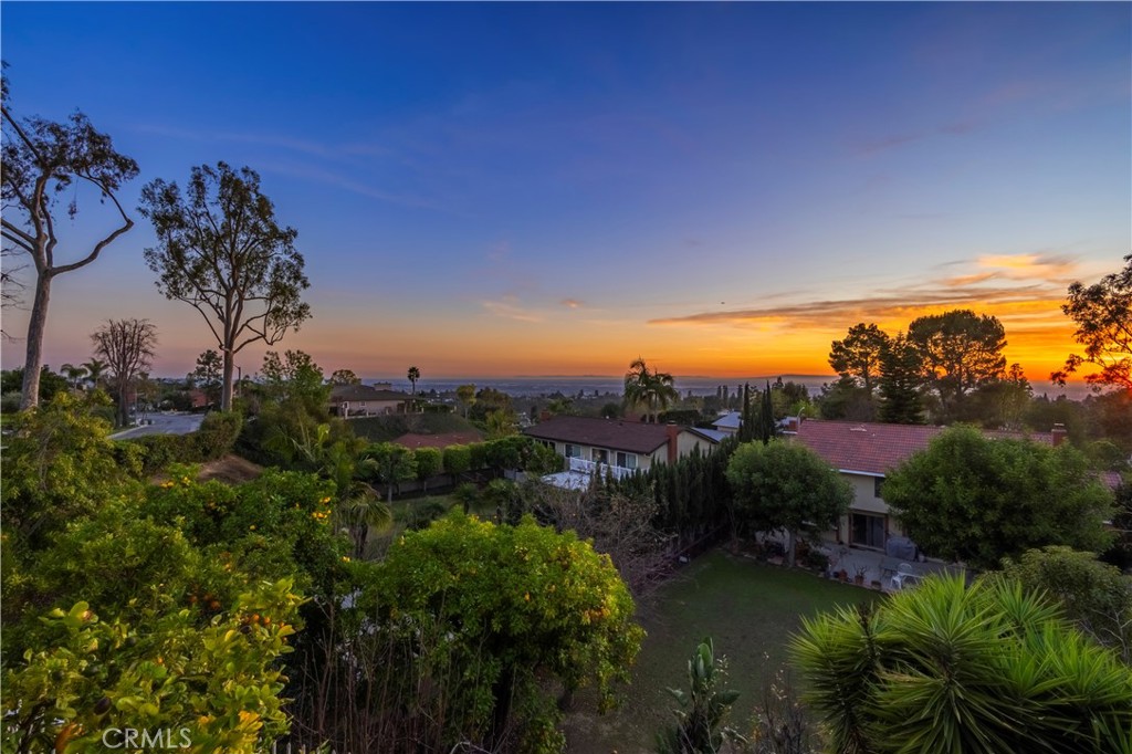 8213 Seranata Drive Whittier, CA 90603 - Photo 50 of 64 a view of a lake with houses in back