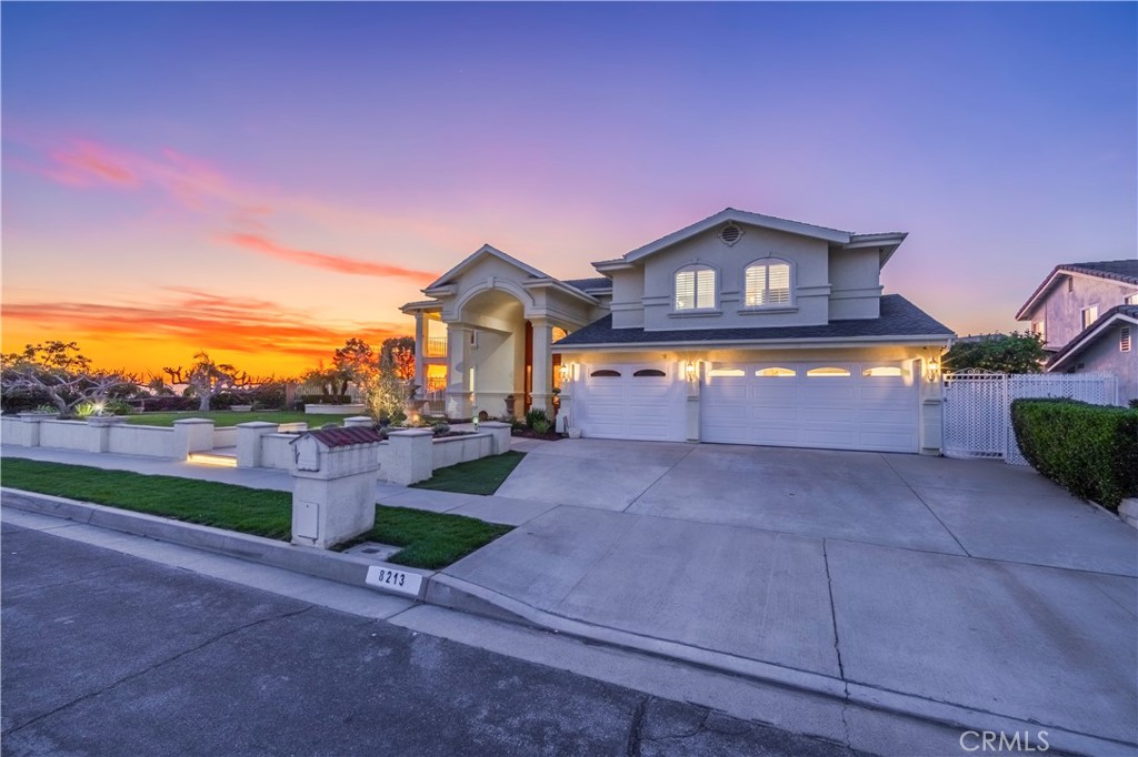 8213 Seranata Drive Whittier, CA 90603 - Photo 5 of 64 a front view of a house with a yard