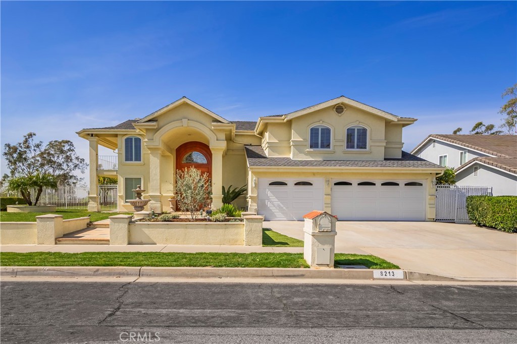 8213 Seranata Drive Whittier, CA 90603 - Photo 55 of 64 a front view of a house with a yard