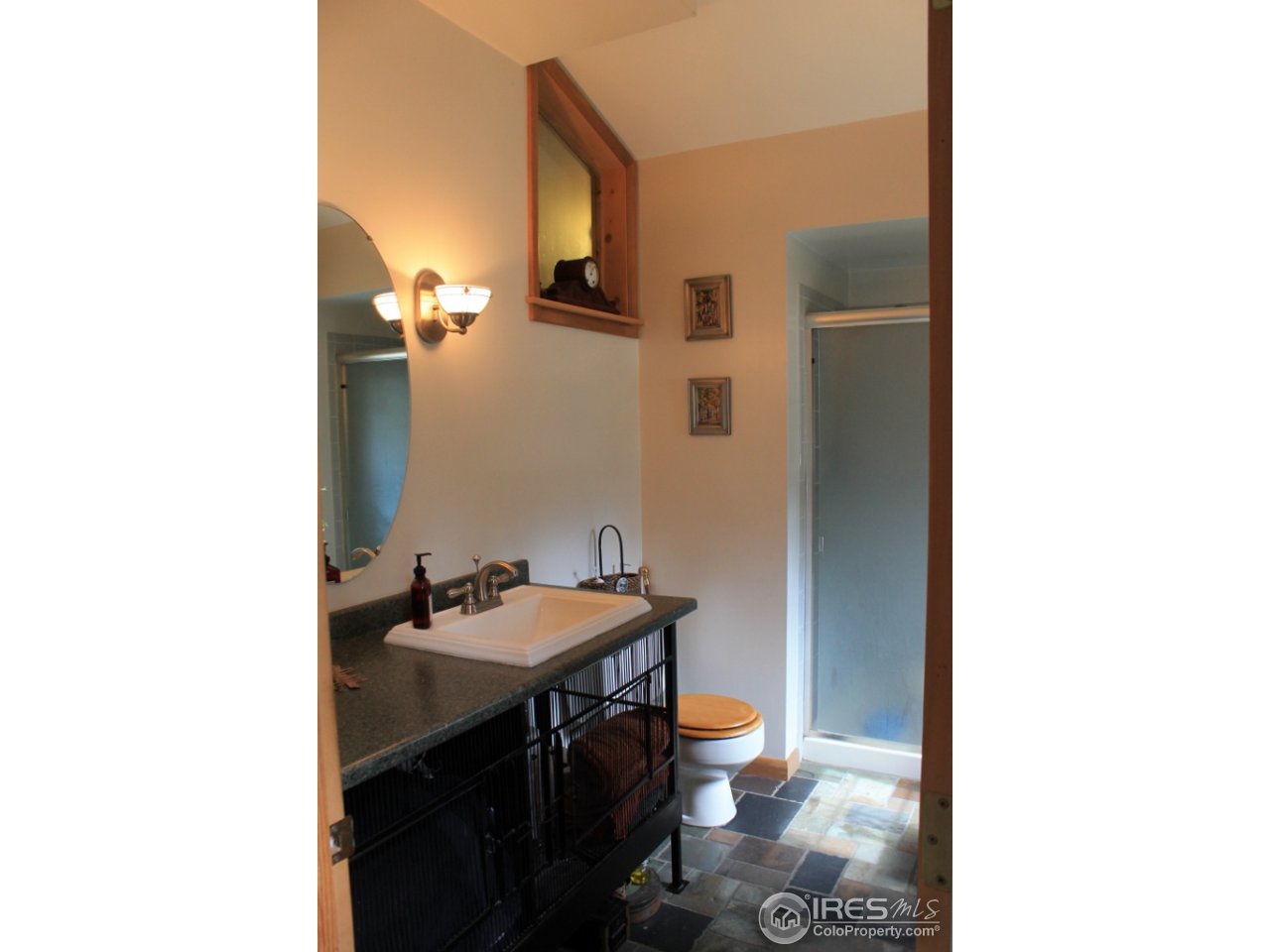 11220 Rist Canyon Road Bellvue, CO 80512 - Photo 11 of 25 a bathroom with a sink and a mirror