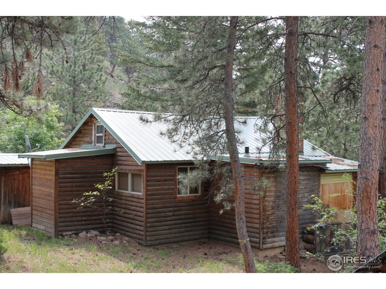 11220 Rist Canyon Road Bellvue, CO 80512 - Photo 14 of 25 a view of a house with a yard