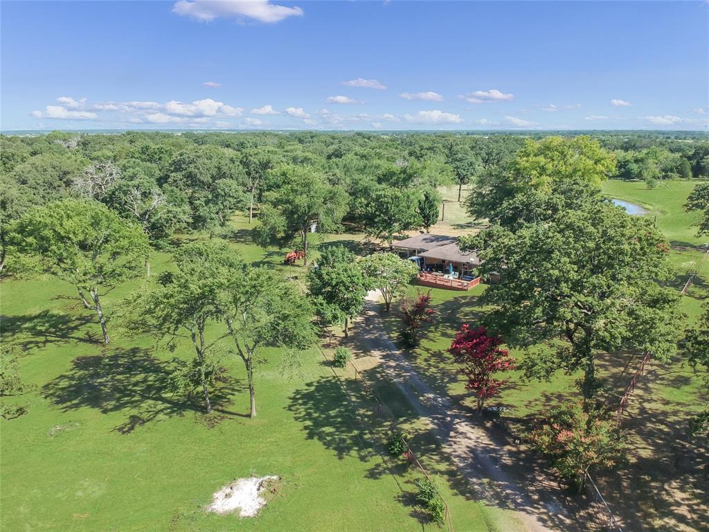 1001 Sandy Ridge Road Scurry, TX 75158 - Photo 3 of 35 Expansive property featuring a single-story residence with a covered porch, set amidst abundant mature trees