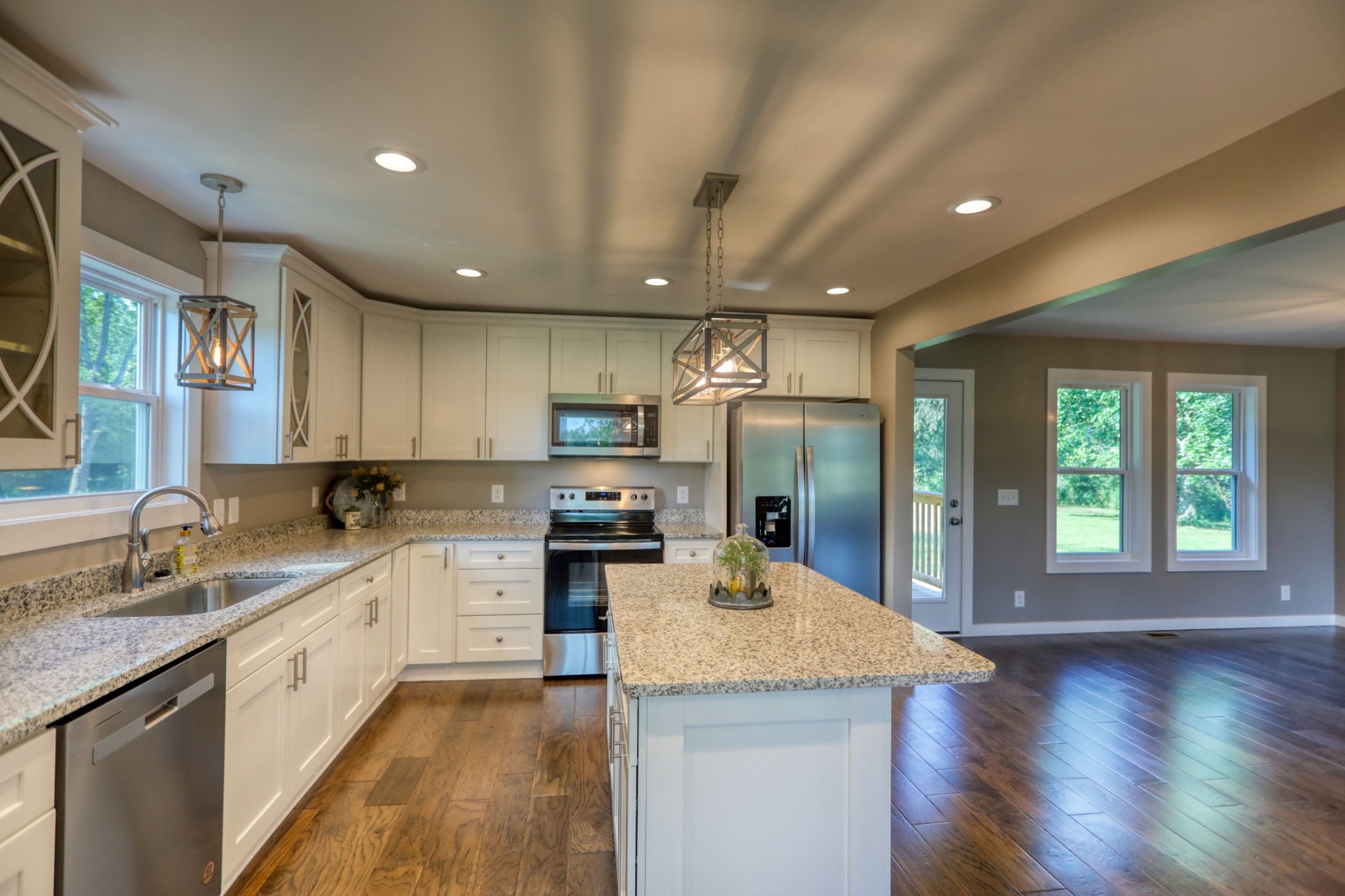 120 Vantrease Road Cottontown, TN 37048 - Photo 12 of 31 a kitchen with granite countertop a sink a counter top space stainless steel appliances and cabinets