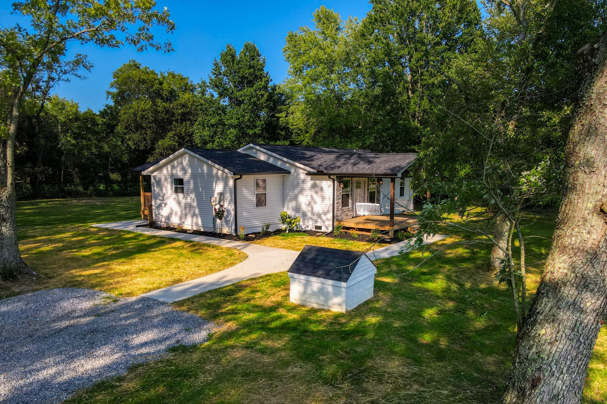 120 Vantrease Road Cottontown, TN 37048 - Photo 2 of 31 a house view with swimming pool and garden space
