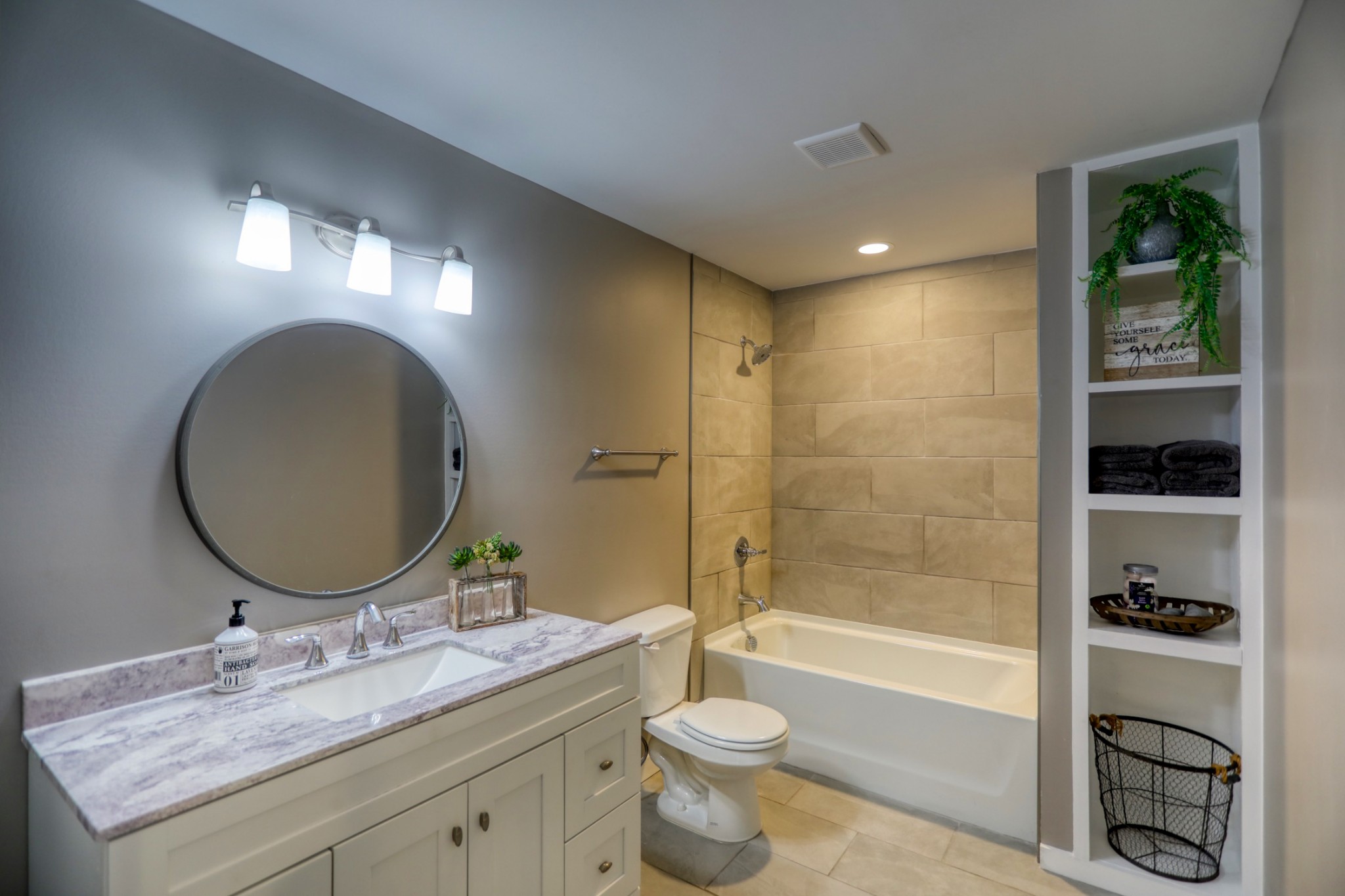 120 Vantrease Road Cottontown, TN 37048 - Photo 22 of 31 a bathroom with a granite countertop sink toilet mirror and bathtub