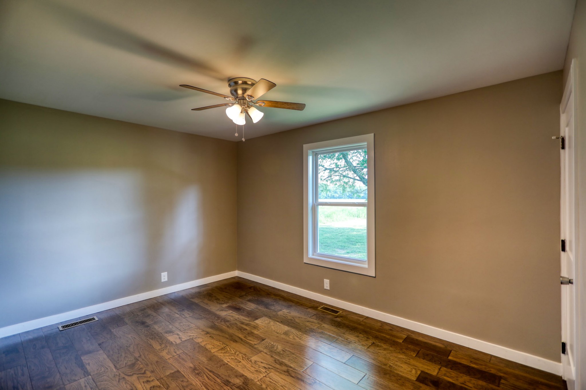 120 Vantrease Road Cottontown, TN 37048 - Photo 23 of 31 a view of empty room with wooden floor and fan