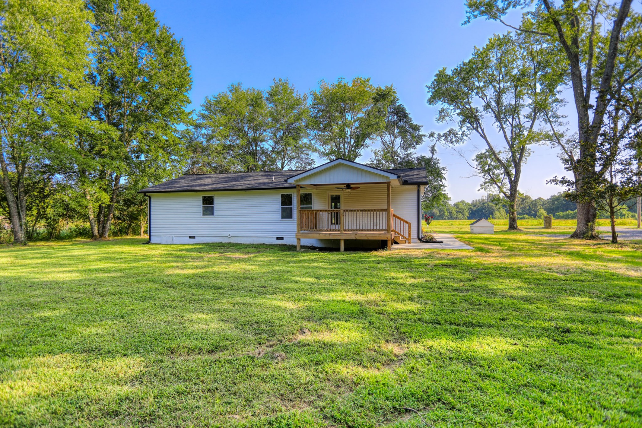 120 Vantrease Road Cottontown, TN 37048 - Photo 26 of 31 a large tree in front of a house with a garden