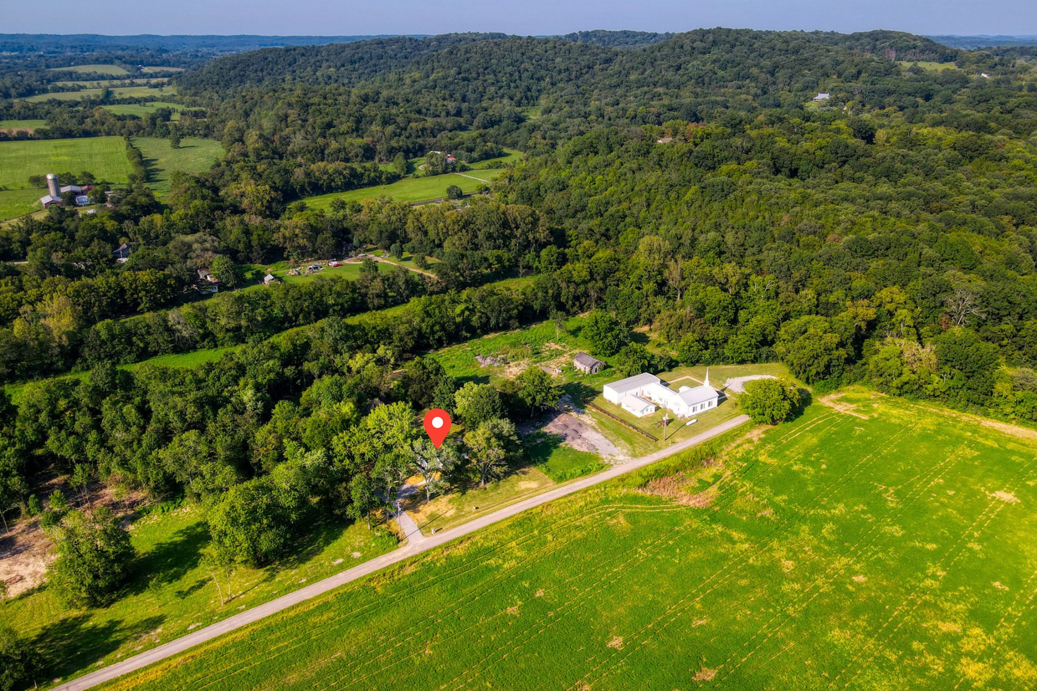 120 Vantrease Road Cottontown, TN 37048 - Photo 28 of 31 a view of a houses with a lush green forest