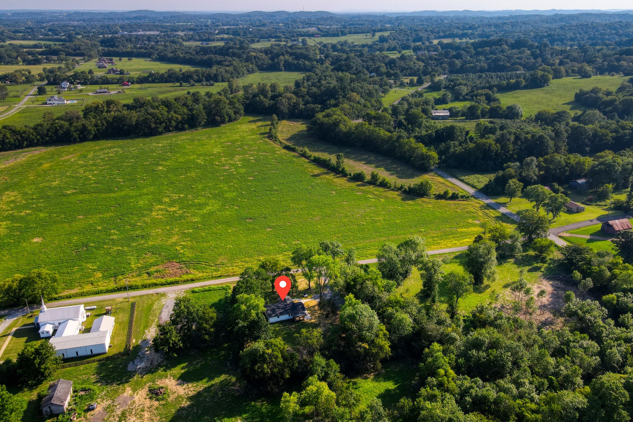 120 Vantrease Road Cottontown, TN 37048 - Photo 30 of 31 an aerial view of a houses with a lush green hillside