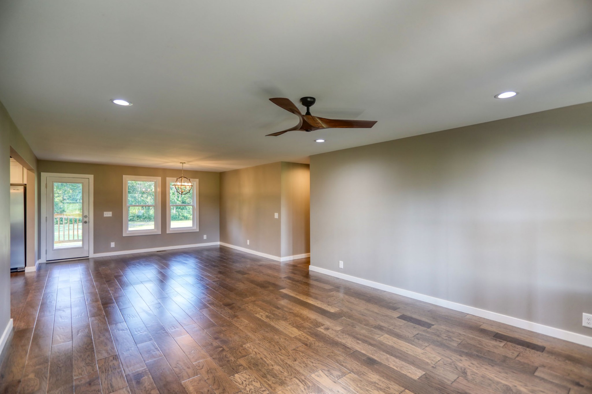 120 Vantrease Road Cottontown, TN 37048 - Photo 6 of 31 a view of an empty room with a window and wooden floor