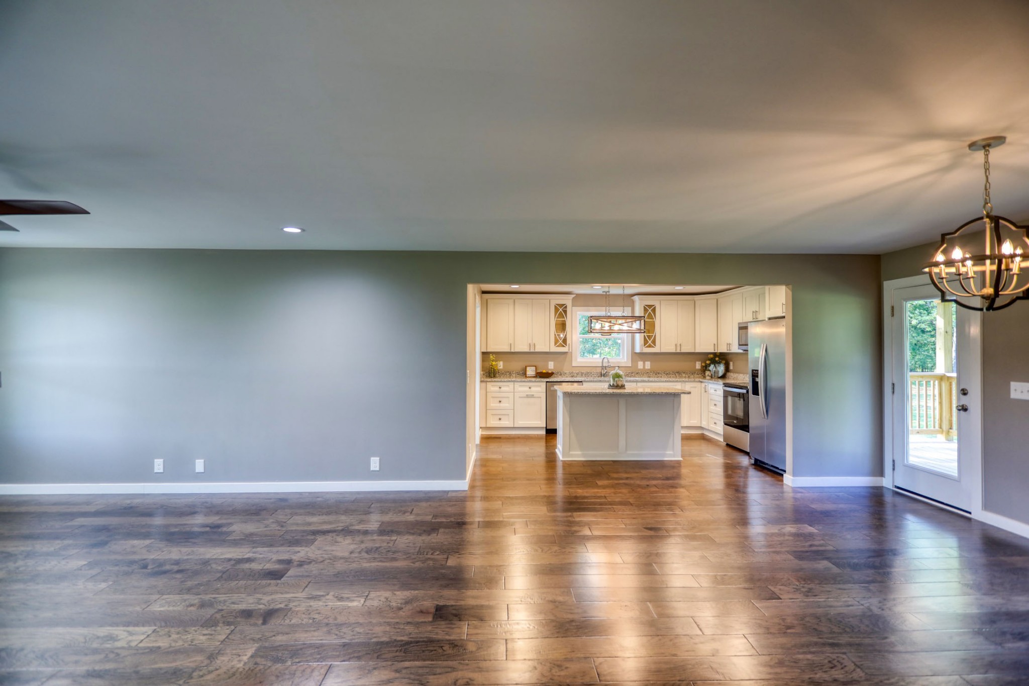 120 Vantrease Road Cottontown, TN 37048 - Photo 9 of 31 a view of open kitchen with kitchen island microwave and stove top oven
