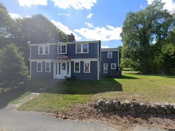 a front view of a house with a yard