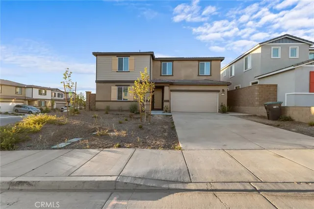 a front view of a house with garage
