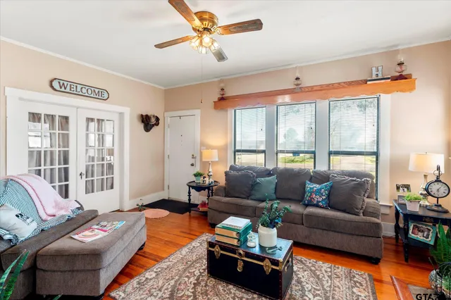 a living room with furniture and a large window