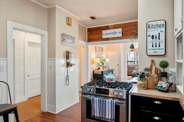 a kitchen with stainless steel appliances granite countertop a stove and a refrigerator