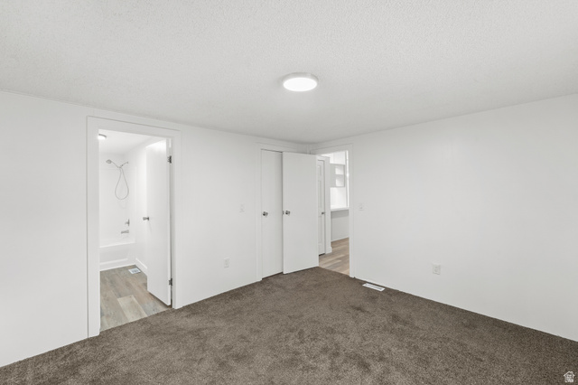 2875 North 400 West, Unit 7 Layton, UT 84041 - Photo 10 of 29 Neutral white walls with textured ceiling and central flush-mount lighting