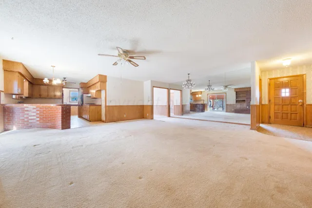 a view of a livingroom with a kitchen