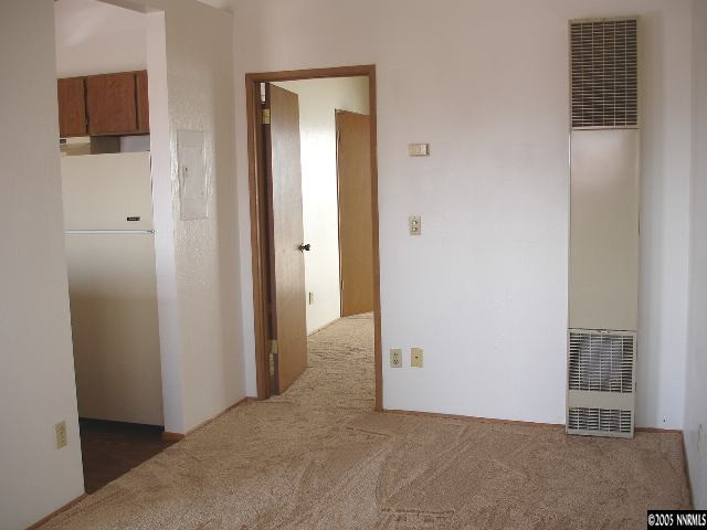 1215 Valley Road, Unit 8 Reno, NV 89512 - Photo 3 of 5 a view of a livingroom with wooden floor and closet