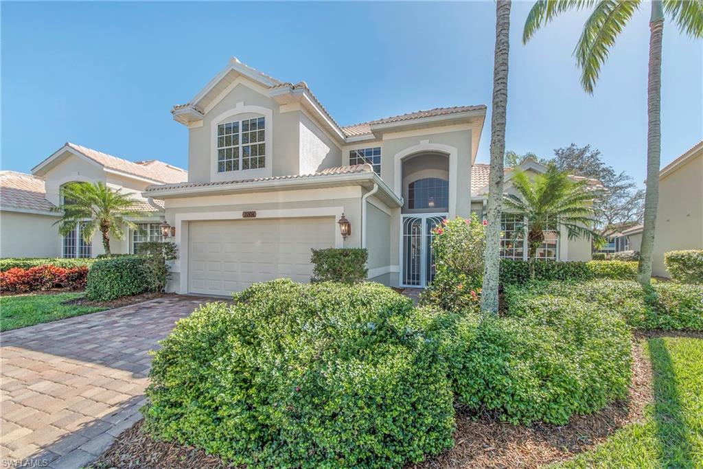 2004 Timarron Way Naples, FL 34109 - Photo 1 of 30 a front view of a house with garden
