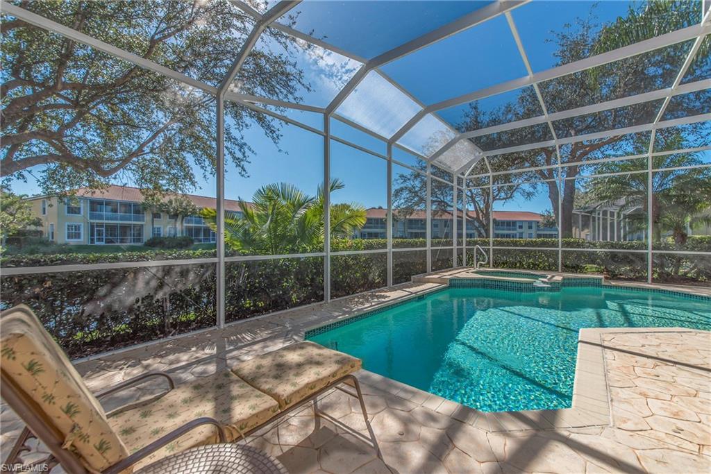 2004 Timarron Way Naples, FL 34109 - Photo 12 of 30 a view of a backyard with a garden and entertaining space