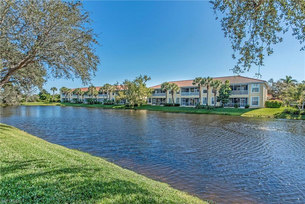 2004 Timarron Way Naples, FL 34109 - Photo 13 of 30 a view of a lake with houses