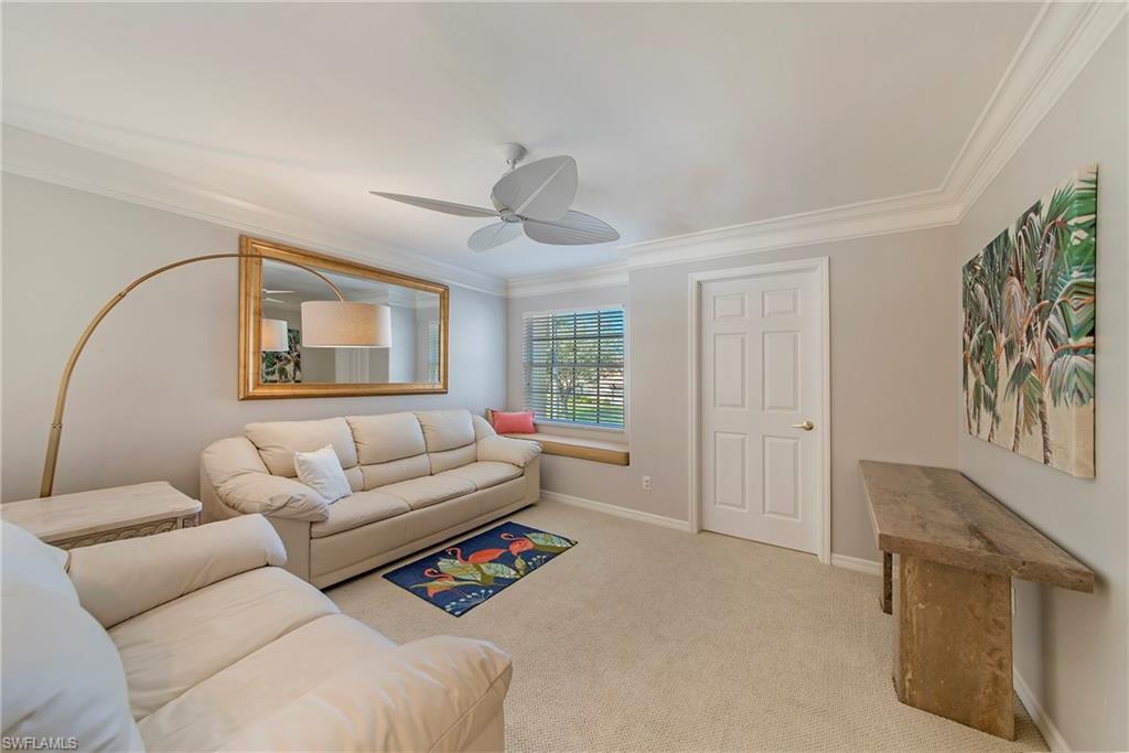 2004 Timarron Way Naples, FL 34109 - Photo 25 of 30 a living room with furniture and a window