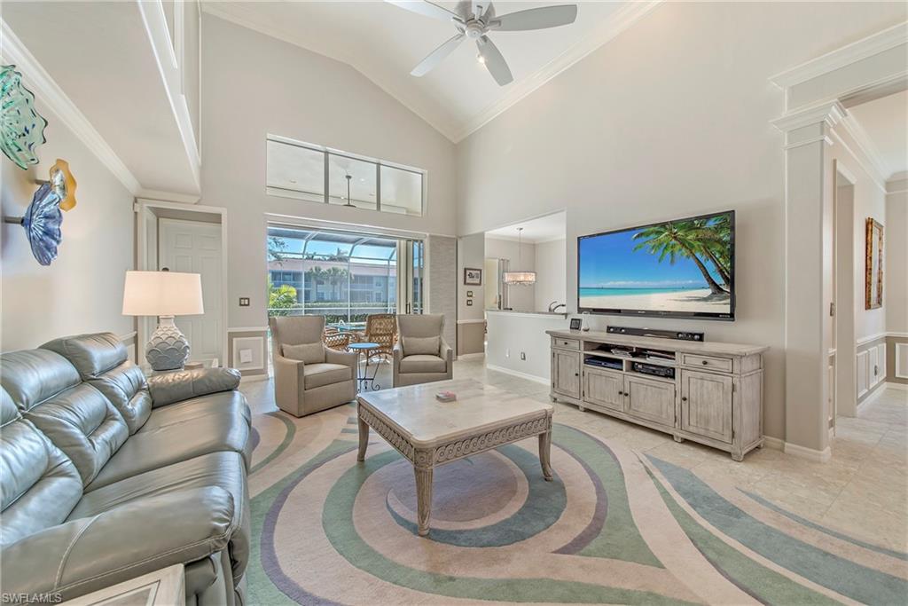 2004 Timarron Way Naples, FL 34109 - Photo 5 of 30 a living room with furniture and a flat screen tv