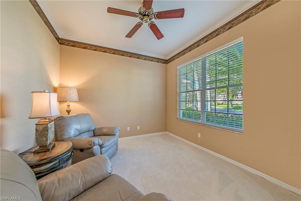 2004 Timarron Way Naples, FL 34109 - Photo 7 of 30 a living room with furniture and a window