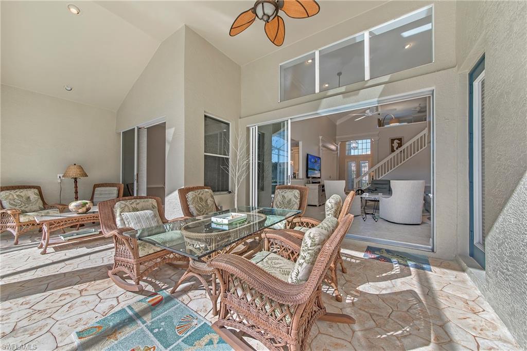 2004 Timarron Way Naples, FL 34109 - Photo 8 of 30 a view of a livingroom with furniture and a table