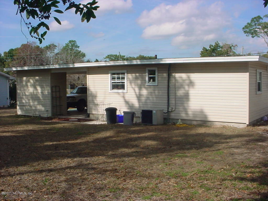 10454 Stone Road Jacksonville, FL 32246 - Photo 4 of 14 a front view of a house with a yard