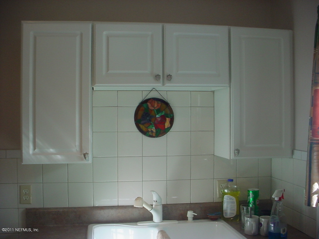 10454 Stone Road Jacksonville, FL 32246 - Photo 8 of 14 a bathroom with a sink and a mirror