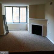 851 North Glebe Road, Unit 807 Arlington, VA 22203 - Photo 2 of 11 a view of empty room with a fireplace