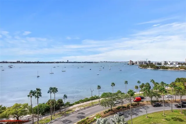 an aerial view of a building and lake view