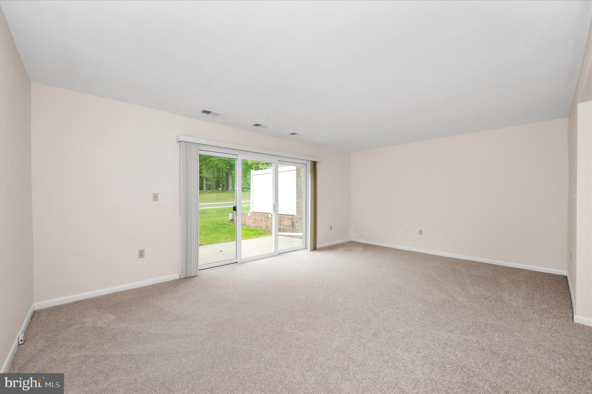 3261 South Leisure World Boulevard, Unit 108F Silver Spring, MD 20906 - Photo 4 of 81 Living Room with slider to patio