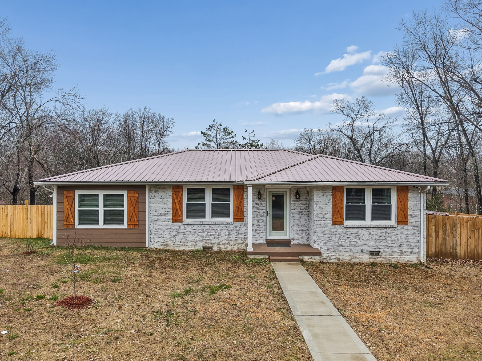 8871 Pinewood Road Lyles, TN 37098 - Photo 1 of 35 a front view of a house with yard