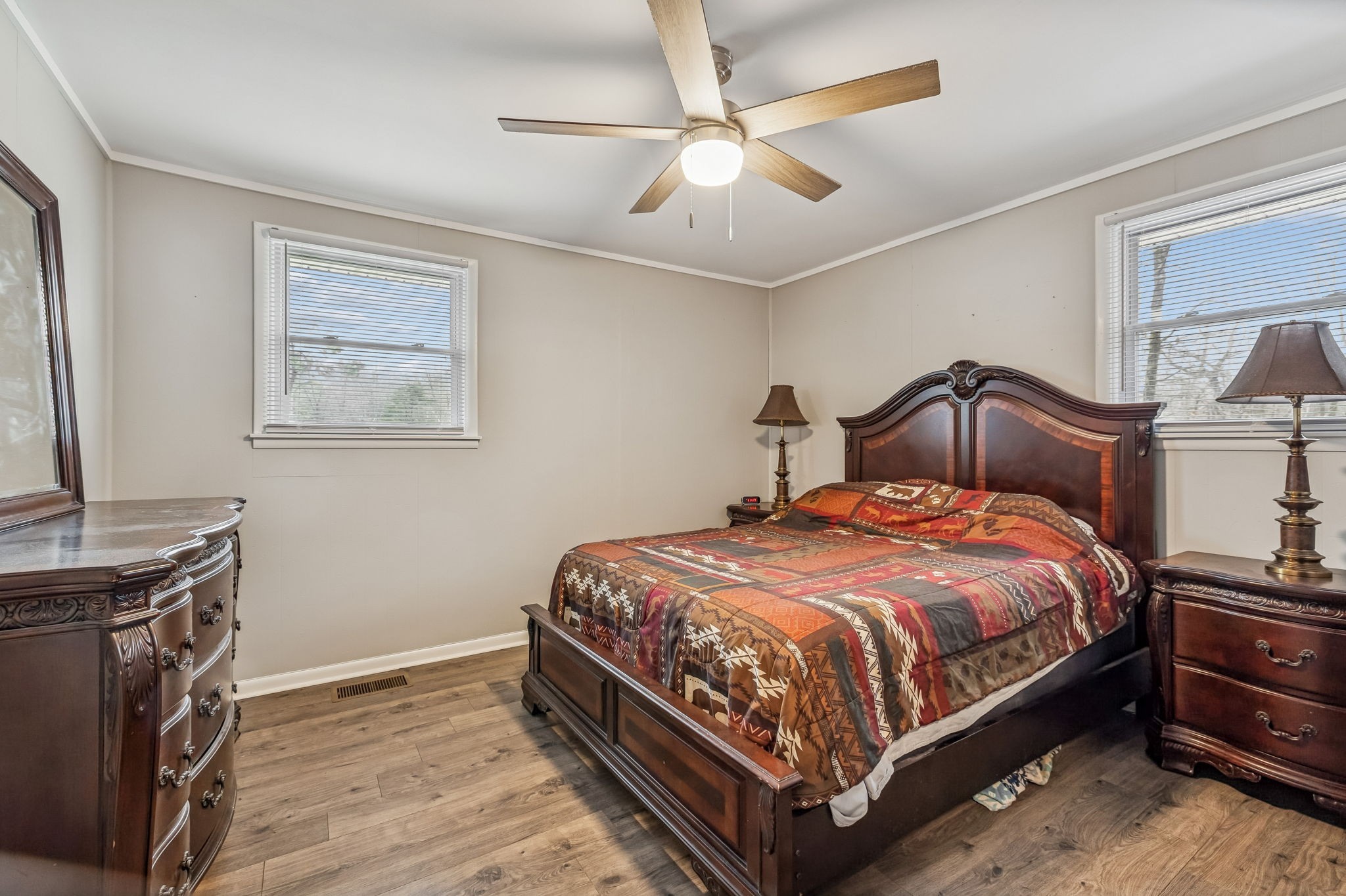 8871 Pinewood Road Lyles, TN 37098 - Photo 17 of 35 a bedroom with a bed and a fireplace