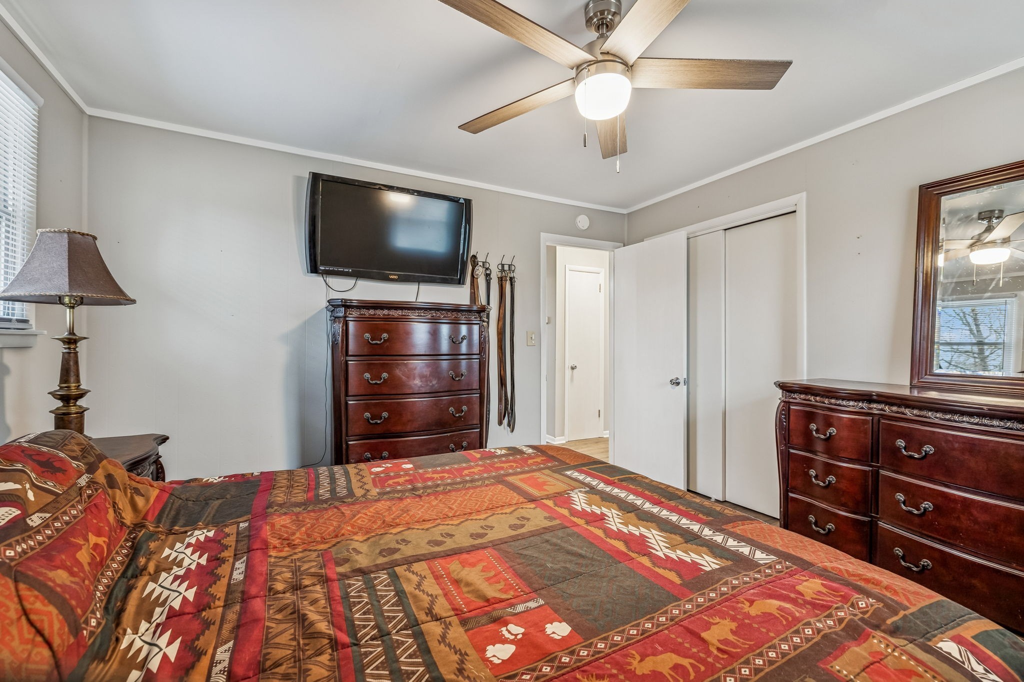 8871 Pinewood Road Lyles, TN 37098 - Photo 18 of 35 a bedroom with a bed and a flat screen tv