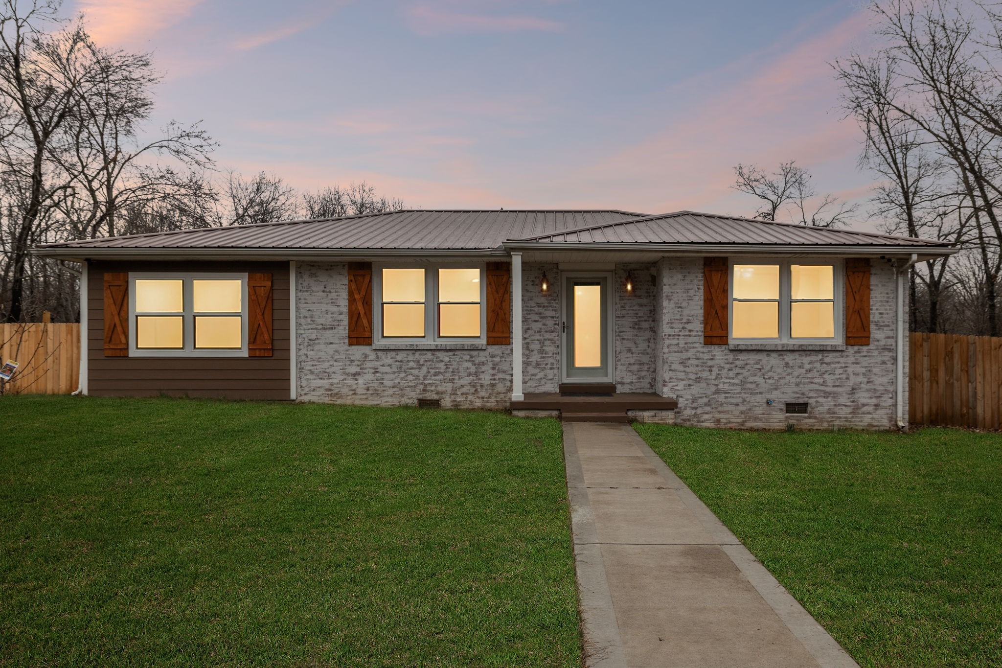 8871 Pinewood Road Lyles, TN 37098 - Photo 2 of 35 a front view of a house with a garden