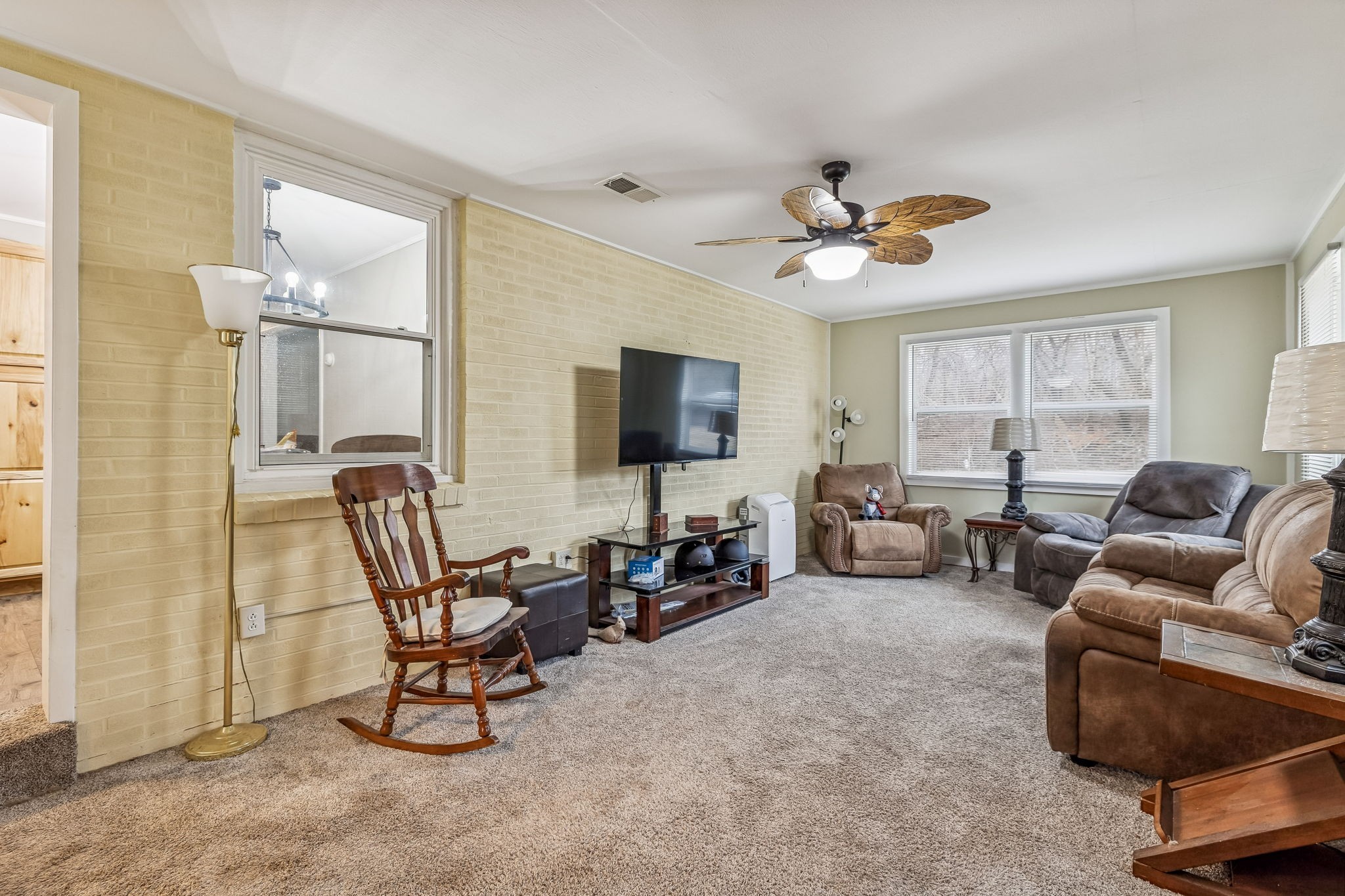 8871 Pinewood Road Lyles, TN 37098 - Photo 21 of 35 a living room with furniture and a flat screen tv