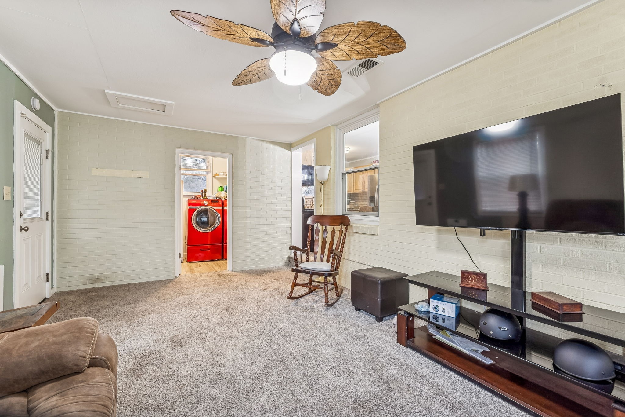 8871 Pinewood Road Lyles, TN 37098 - Photo 23 of 35 a living room with furniture and a flat screen tv
