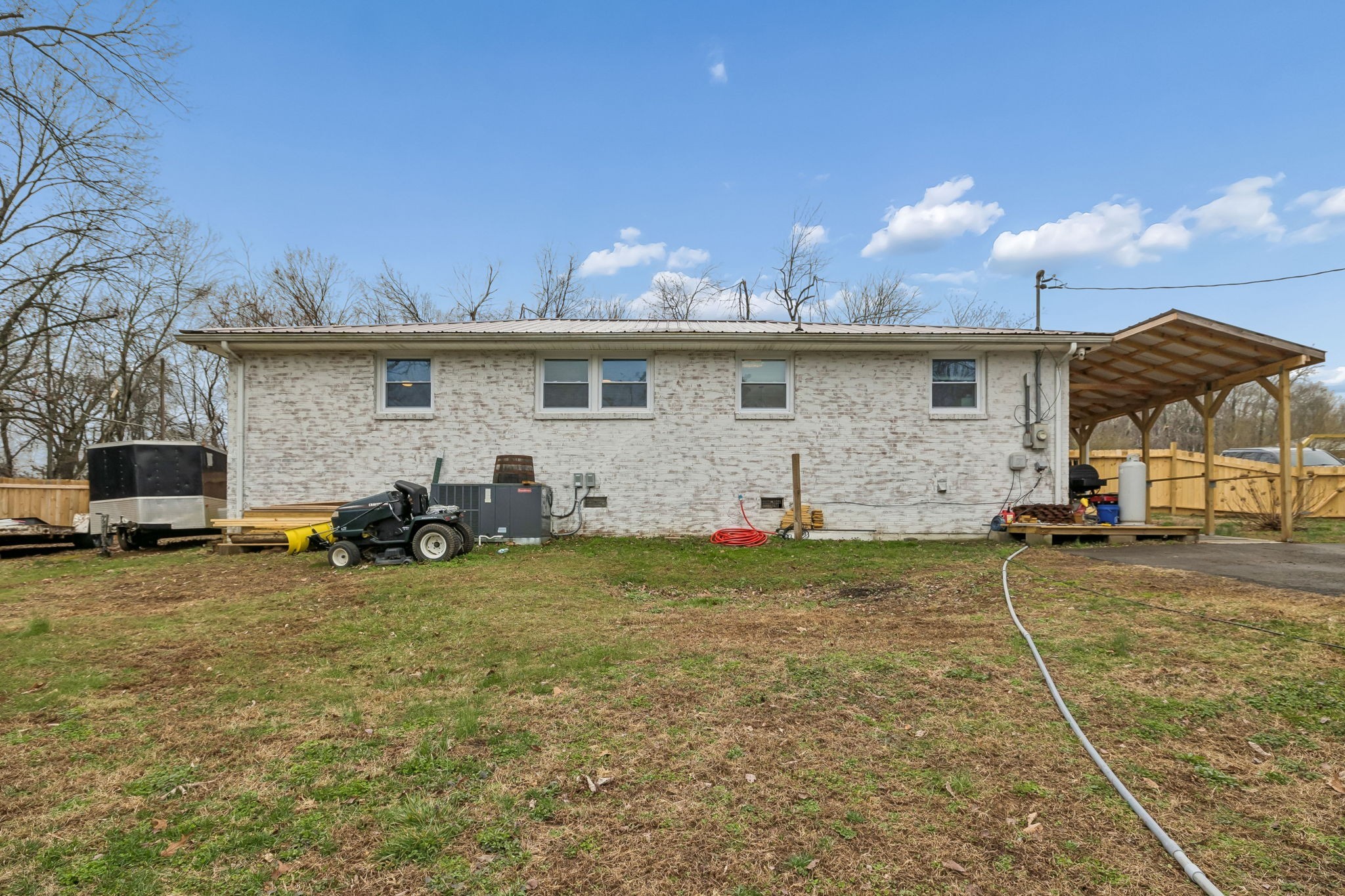 8871 Pinewood Road Lyles, TN 37098 - Photo 30 of 35 a backyard of a house with table and chairs